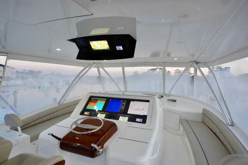 Slide: The Image of Interior of 2019 Viking 68 Convertible yacht with advanced navigation system. - 44
