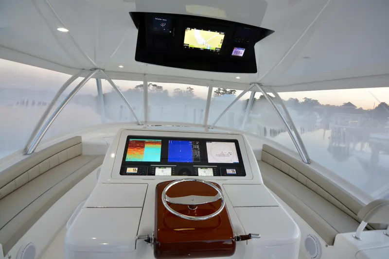 Slide: The Image of Cockpit of 2019 Viking 68 Convertible yacht with advanced navigation displays. - 45