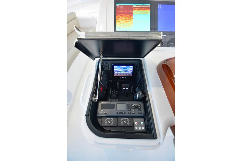 Slide: The Image of 2019 Viking 68 Convertible yacht control panel with advanced navigation displays. - 46