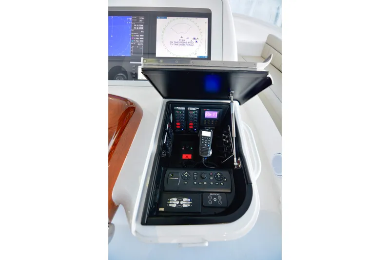 Slide: The Image of Control panel of 2019 Viking 68 Convertible yacht with navigation and communication equipment. - 47