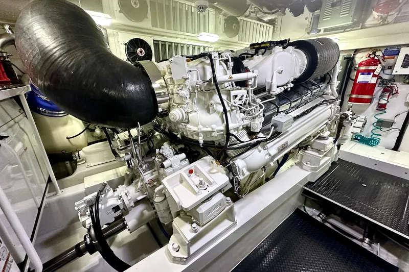 Slide: The Image of Engine room of 2019 Viking 68 Convertible yacht, showcasing powerful machinery and equipment. - 52