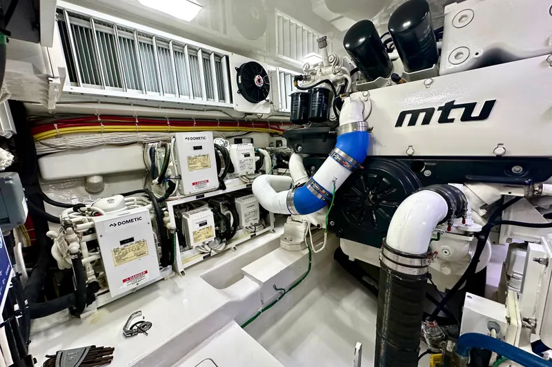 Slide: The Image of Engine room of 2019 Viking 68 Convertible yacht with MTU components and Dometic systems. - 53