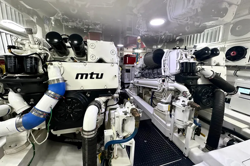 Slide: The Image of Engine room of 2019 Viking 68 Convertible yacht featuring MTU engines. - 56