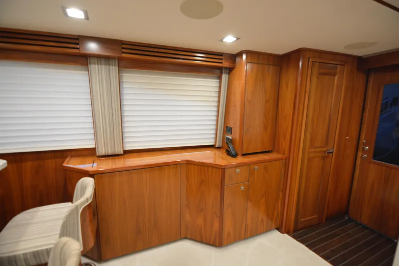 Slide: The Image of Luxurious interior of 2019 Viking 68 Convertible yacht with elegant wood finish. - 6