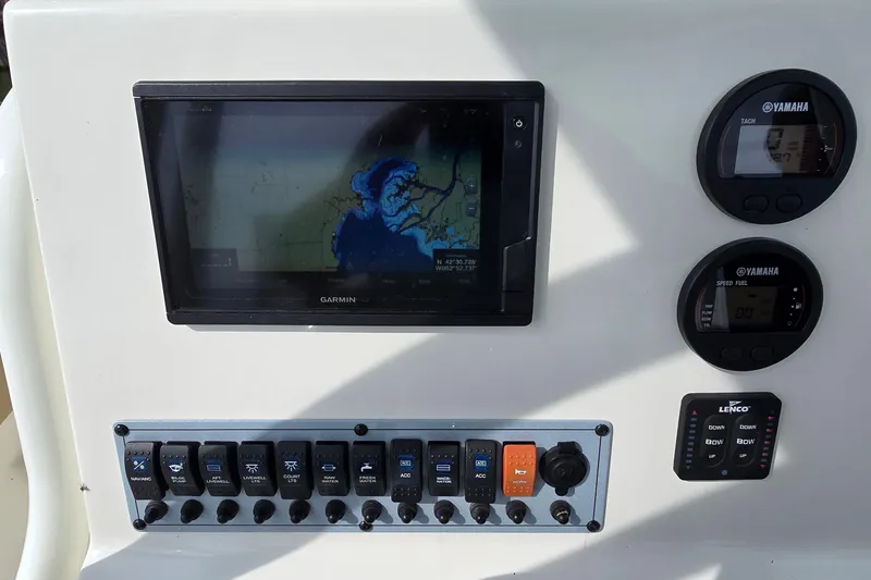 Slide: The Image of Control panel of 2020 Key West 239 FS boat with Garmin display and Yamaha gauges. - 10