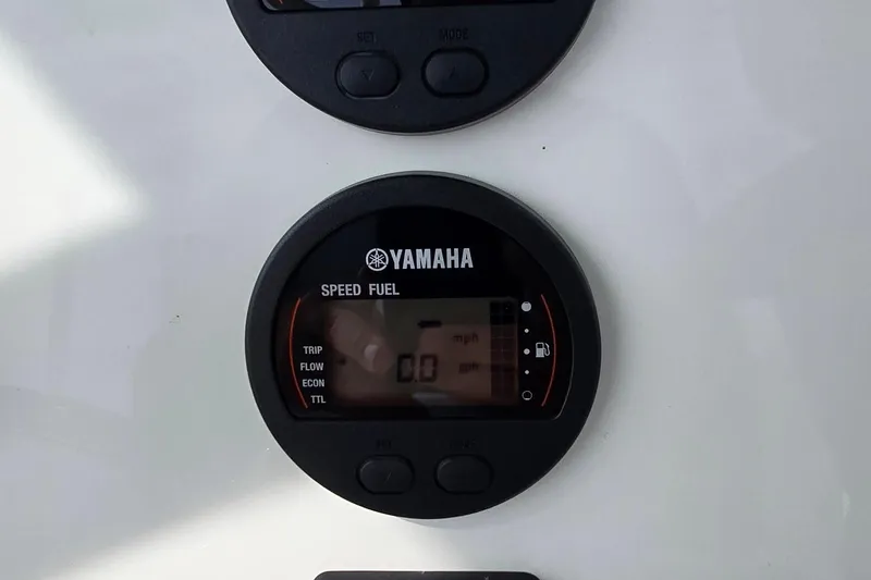 Slide: The Image of Yamaha speed and fuel gauge on 2020 Key West 239 FS boat dashboard. - 13