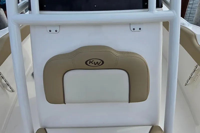Slide: The Image of 2020 Key West 239 FS boat seat with KW logo, beige and white upholstery. - 15