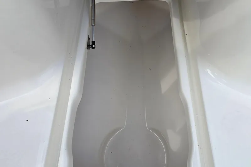 Slide: The Image of 2020 Key West 239 FS boat storage compartment, clean and spacious interior. - 17