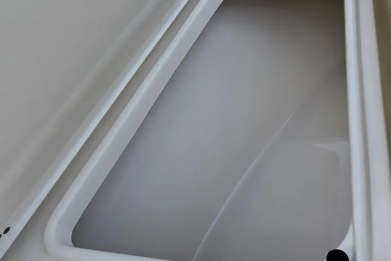 Slide: The Image of Storage compartment of a 2020 Key West 239 FS boat, featuring a clean, white interior. - 18