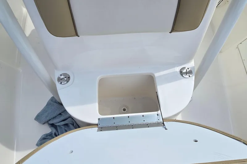 Slide: The Image of 2020 Key West 239 FS boat interior with storage compartment and seating. - 20