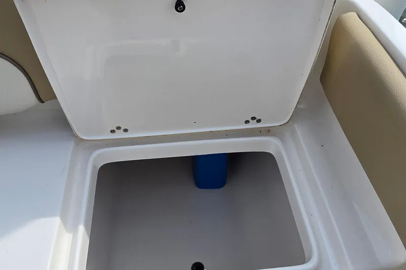 Slide: The Image of Open storage compartment on a 2020 Key West 239 FS boat. - 23