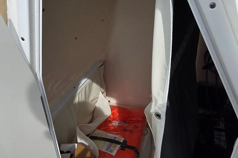 Slide: The Image of Storage compartment in 2020 Key West 239 FS boat, featuring life jacket and equipment. - 29
