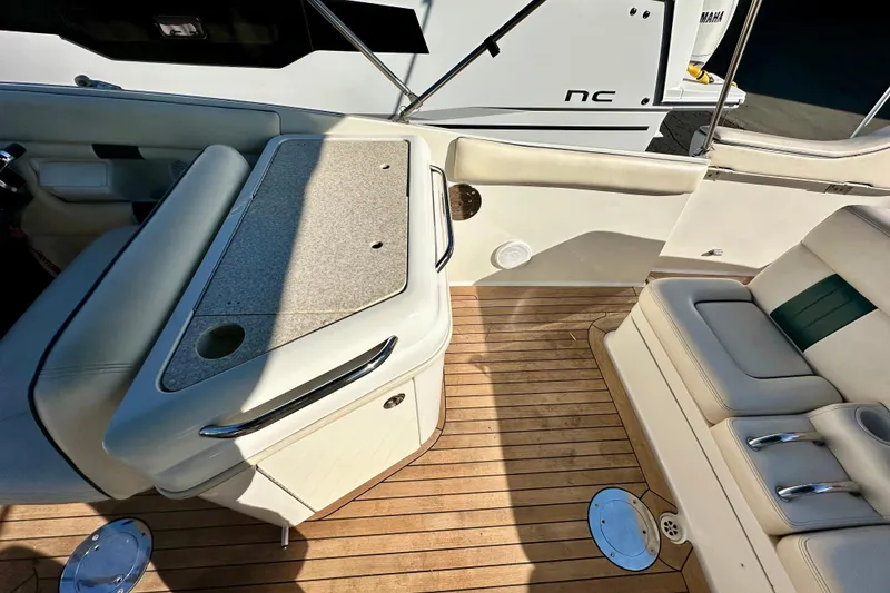 Slide: The Image of Luxurious interior of 2002 Chris-Craft Launch 28 with teak flooring and plush seating. - 13