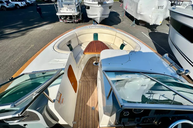 Slide: The Image of 2002 Chris-Craft Launch 28 boat with wooden deck and spacious seating area. - 15