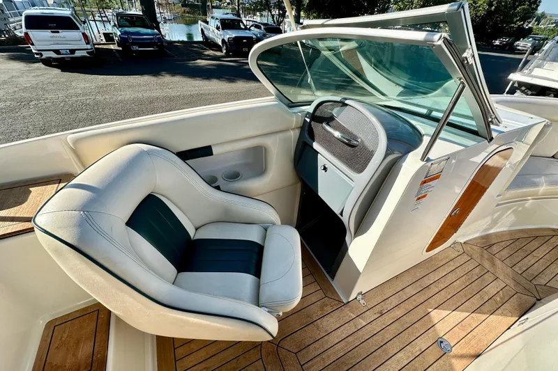 Slide: The Image of 2002 Chris-Craft Launch 28 boat interior with elegant seating and wooden flooring. - 16
