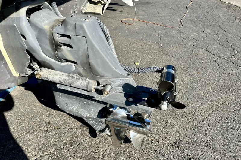 Slide: The Image of Close-up of a 2002 Chris-Craft Launch 28 boat propeller and drive system on pavement. - 23