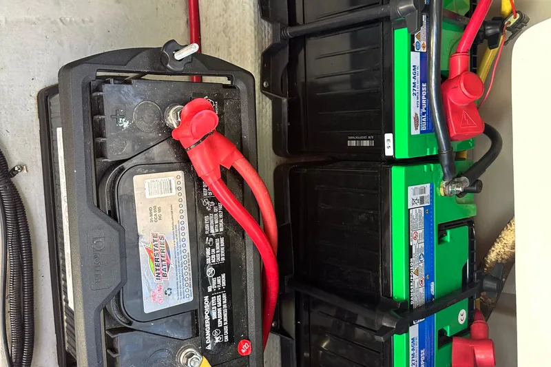 Slide: The Image of Battery setup in a 2002 Chris-Craft Launch 28 boat, featuring Interstate batteries. - 27