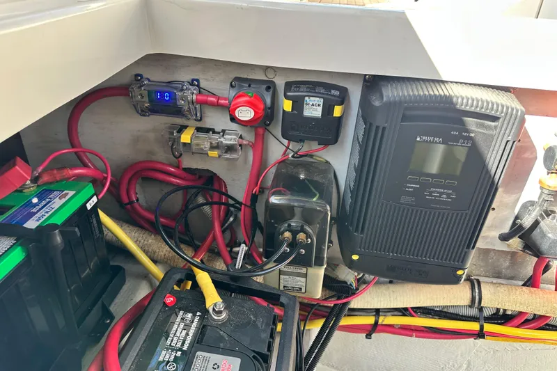 Slide: The Image of Electrical system of a 2002 Chris-Craft Launch 28 boat, featuring batteries and wiring. - 28