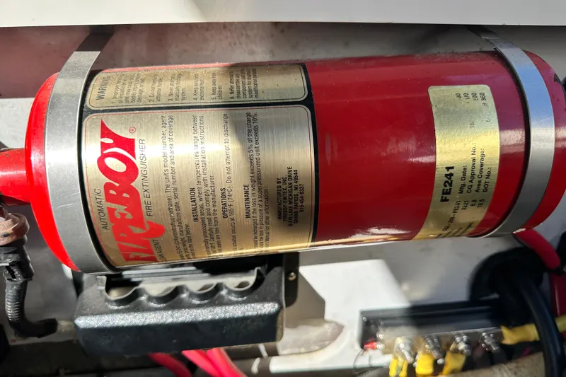 Slide: The Image of Automatic Fireboy fire extinguisher in a 2002 Chris-Craft Launch 28 boat. - 29