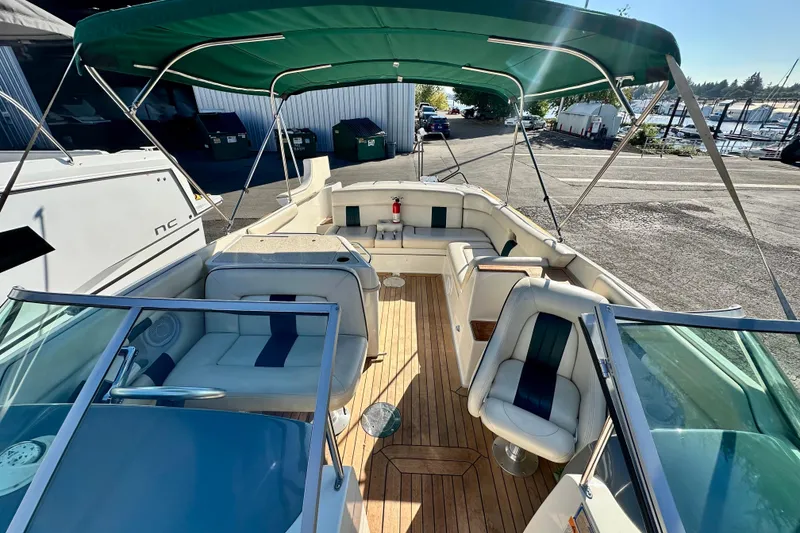 Slide: The Image of 2002 Chris-Craft Launch 28 boat with green canopy and spacious seating area. - 3