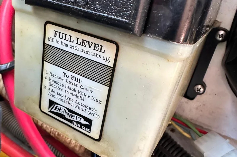 Slide: The Image of Close-up of Bennett trim tab fluid reservoir with filling instructions, Chris-Craft Launch 28, 2002. - 31