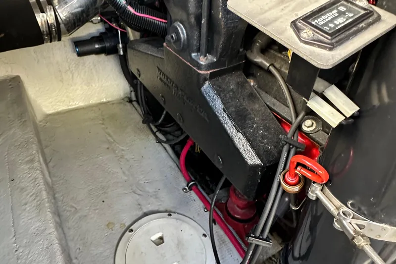 Slide: The Image of Engine compartment of a 2002 Chris-Craft Launch 28 boat, showcasing mechanical components. - 36