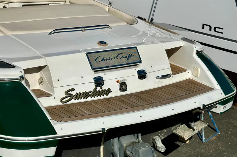 Slide: The Image of 2002 Chris-Craft Launch 28 boat with "Sunshine" nameplate, featuring teak decking. - 42
