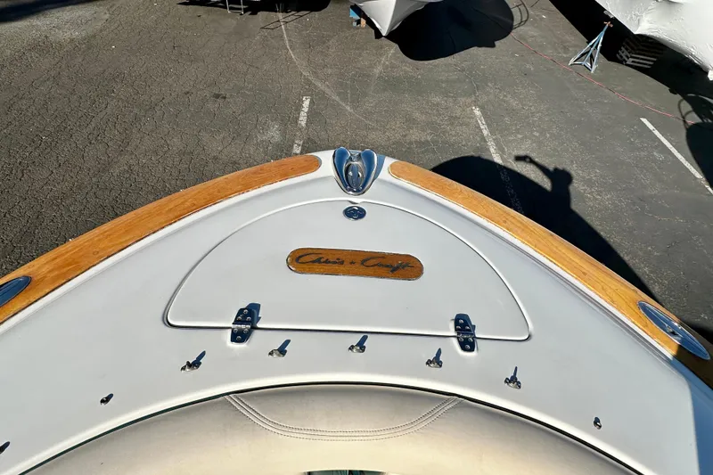 Slide: The Image of 2002 Chris-Craft Launch 28 boat with wooden accents and sleek design. - 5