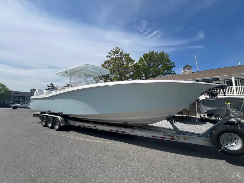 The Image of 2024 Invincible 39 Open Fisherman boat on a trailer in a parking lot. - 0