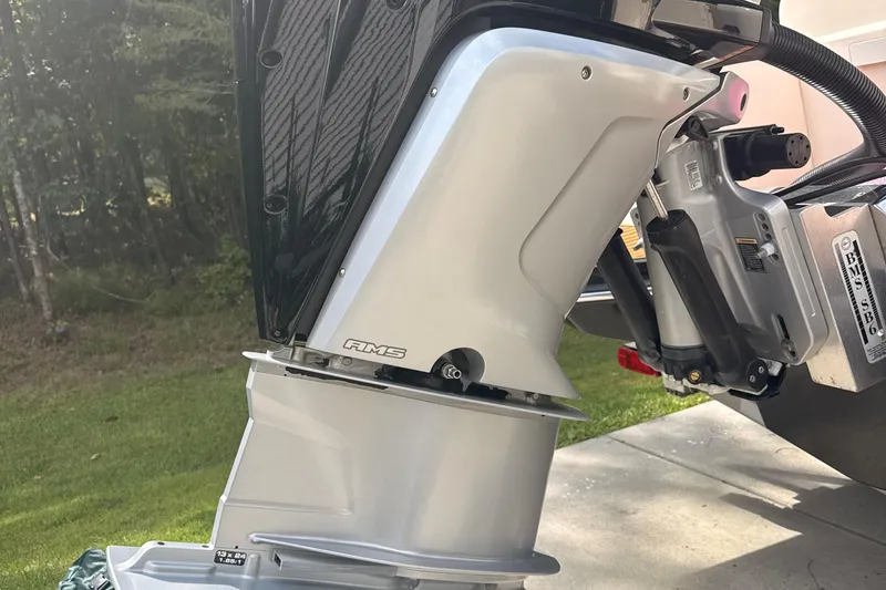 Slide: The Image of Close-up of a 2021 Scout 235 XSF boat engine, outdoors. - 3