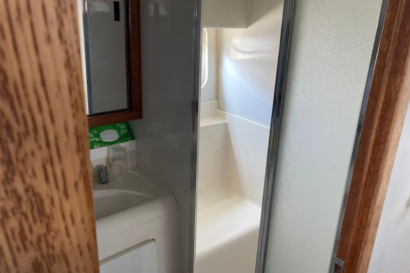 Slide: The Image of Bathroom interior of 1999 Bayliner 3388 Command Bridge Motoryacht with sink and shower. - 41