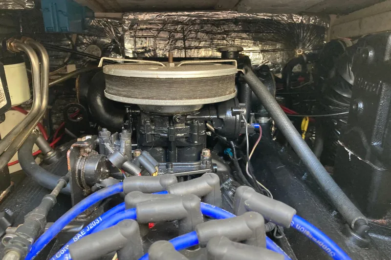 Slide: The Image of Engine compartment of a 1999 Bayliner 3388 Command Bridge Motoryacht, showcasing mechanical components. - 47