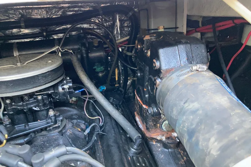 Slide: The Image of Engine compartment of a 1999 Bayliner 3388 Command Bridge Motoryacht, showing mechanical components. - 48