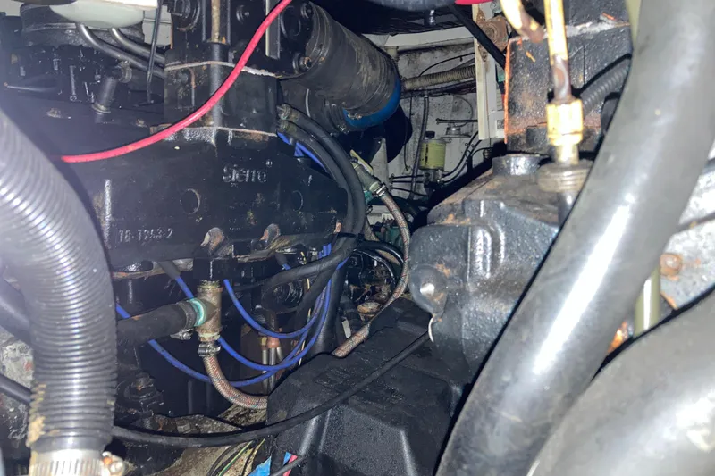 Slide: The Image of Engine compartment of a 1999 Bayliner 3388 Command Bridge Motoryacht, showcasing mechanical components. - 50