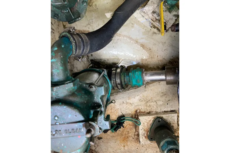 Slide: The Image of Engine compartment of 1999 Bayliner 3388 Command Bridge Motoryacht, showing mechanical components. - 58