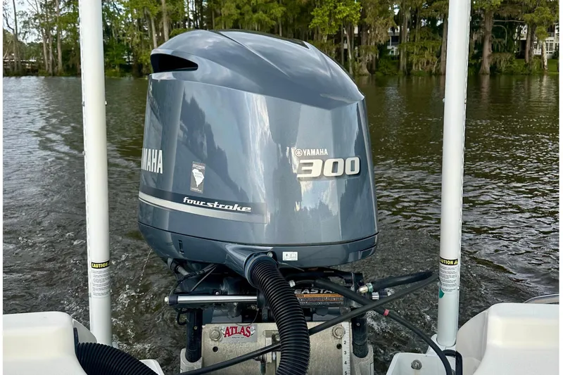 Slide: The Image of 2019 Pathfinder 2500 Hybrid with Yamaha 300 engine on a lake. - 15