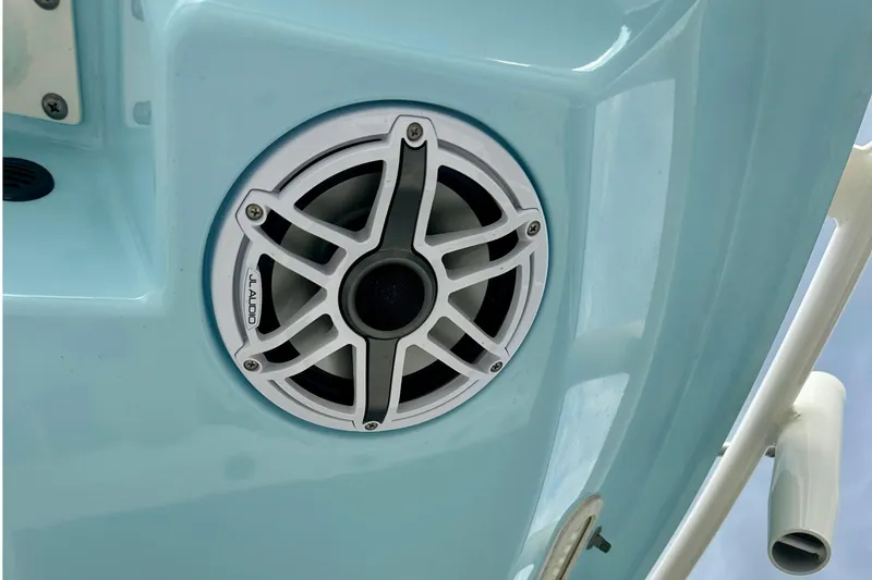 Slide: The Image of 2019 Pathfinder 2500 Hybrid boat speakers and rod holders against a cloudy sky. - 16