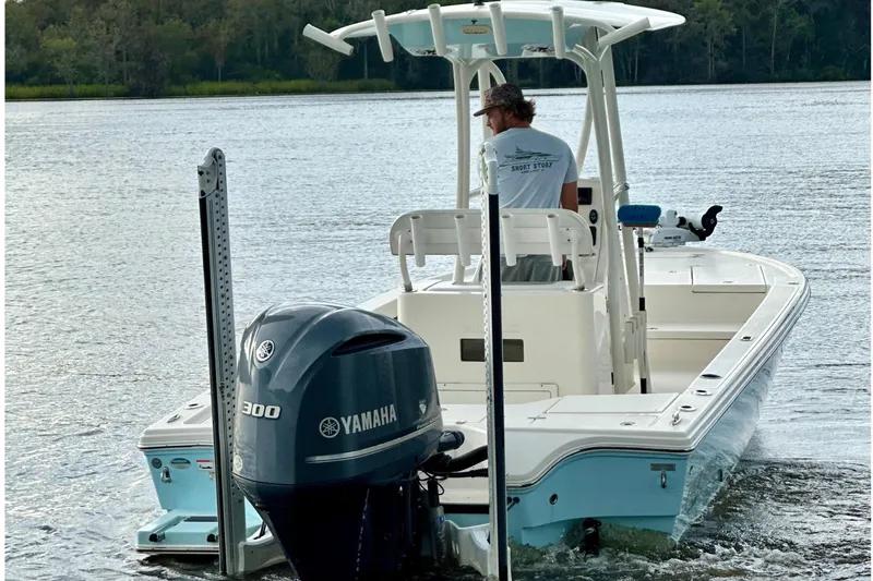 Slide: The Image of 2019 Pathfinder 2500 Hybrid boat with Yamaha engine on a calm river. - 4