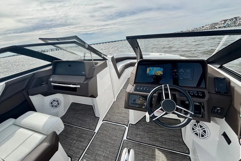 Slide: The Image of 2024 Cobalt R4 Outboard boat interior with modern dashboard and steering wheel. - 6