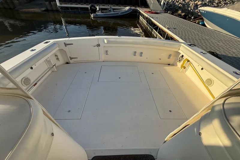 Slide: The Image of 1997 Wellcraft 3300 Coastal boat deck, spacious and clean, docked at marina. - 12