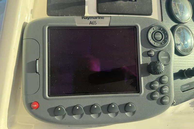Slide: The Image of Raymarine A65 marine GPS system on 1997 Wellcraft 3300 Coastal boat dashboard. - 13