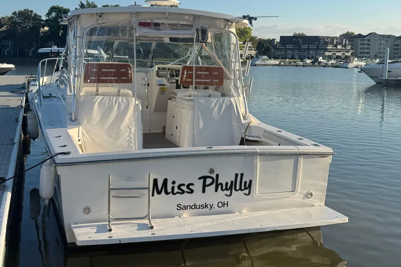 Slide: The Image of 1997 Wellcraft 3300 Coastal boat docked, named "Miss Phylly," in Sandusky, Ohio marina. - 17