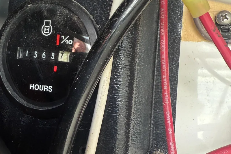 Slide: The Image of Hour meter reading 1363.7 on a 1997 Wellcraft 3300 Coastal boat dashboard. - 2