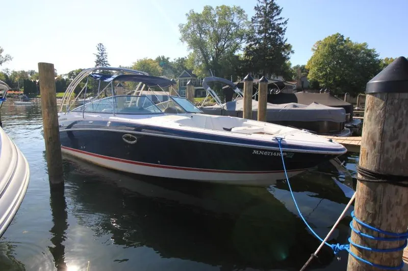 The Image of 2008 Four Winns 310 Horizon boat docked in a sunny marina. - 0