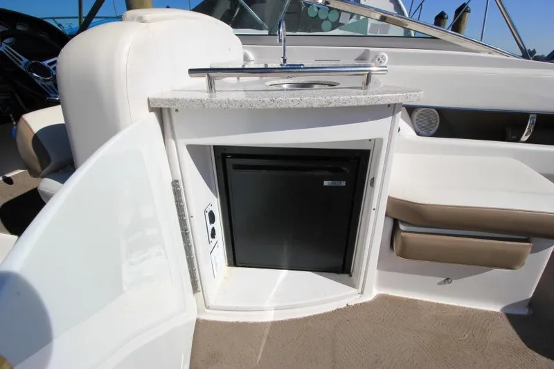 Slide: The Image of 2008 Four Winns 310 Horizon boat interior with sink and mini fridge. - 11