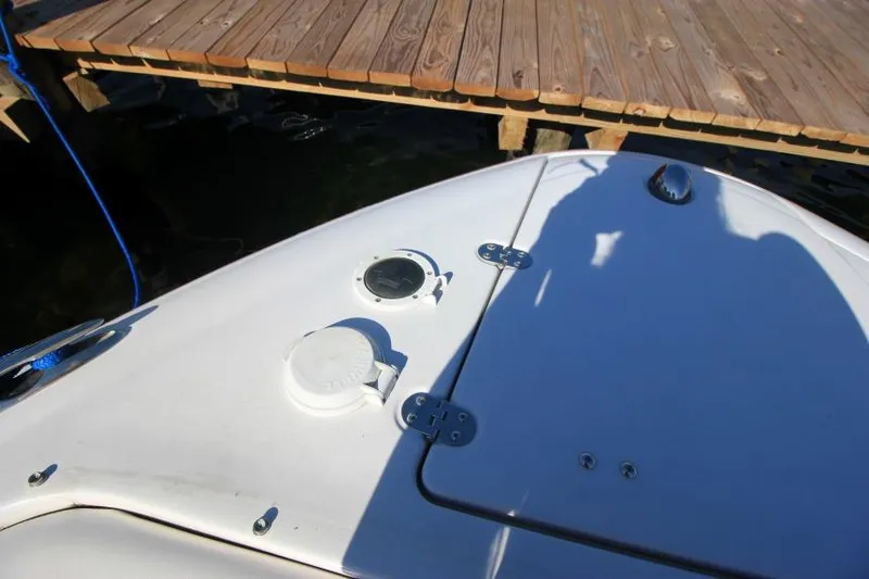 Slide: The Image of Bow of 2008 Four Winns 310 Horizon boat near wooden dock. - 23