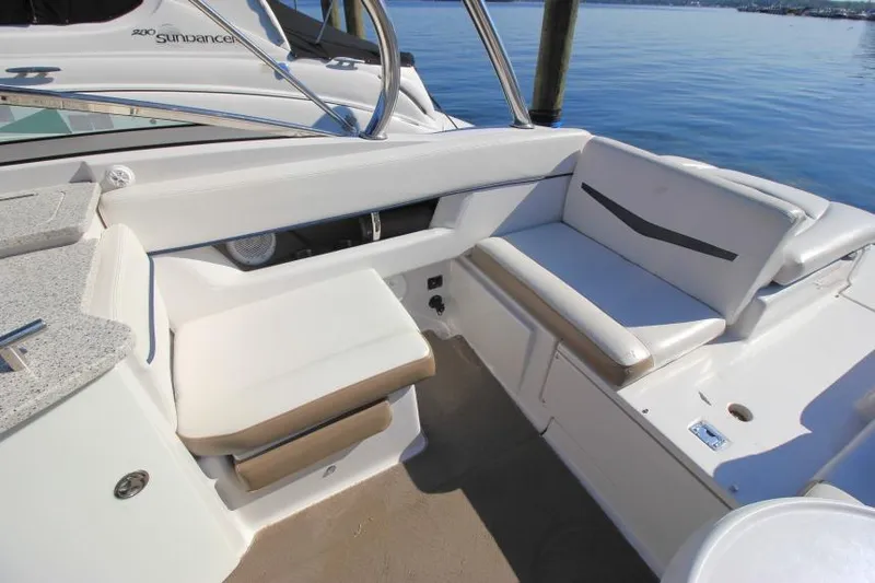 Slide: The Image of 2008 Four Winns 310 Horizon boat interior with white seating and water view. - 6