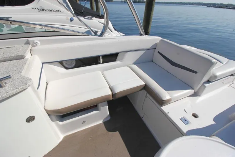 Slide: The Image of 2008 Four Winns 310 Horizon boat interior with white seating and lake view. - 7