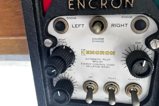 Slide: The Image of 1973 Tollycraft 40' Aft Cabin autopilot control panel by Encron, featuring course and speed adjustments. - 14