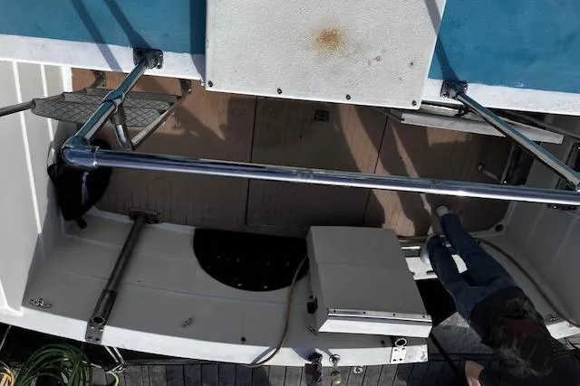 Slide: The Image of 1973 Tollycraft 40' Aft Cabin boat deck with stainless steel railings and wooden flooring. - 21